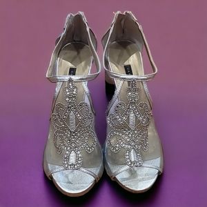 Womens size 8 silver with rhinestones heels.